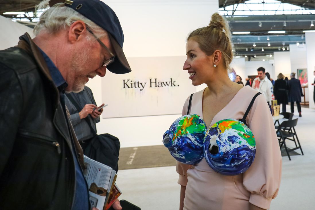 a woman wearing a bra made of globes